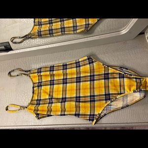 yellow stripped body suit